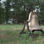 Large bell on scoutmaster's hill